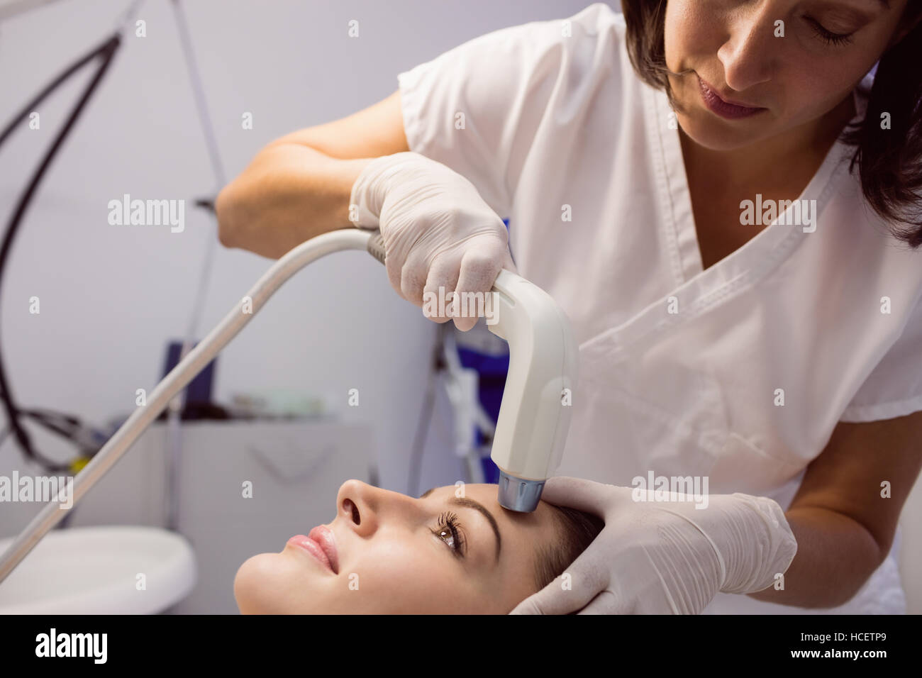 Doctor giving cosmetic treatment to female patient Stock Photo