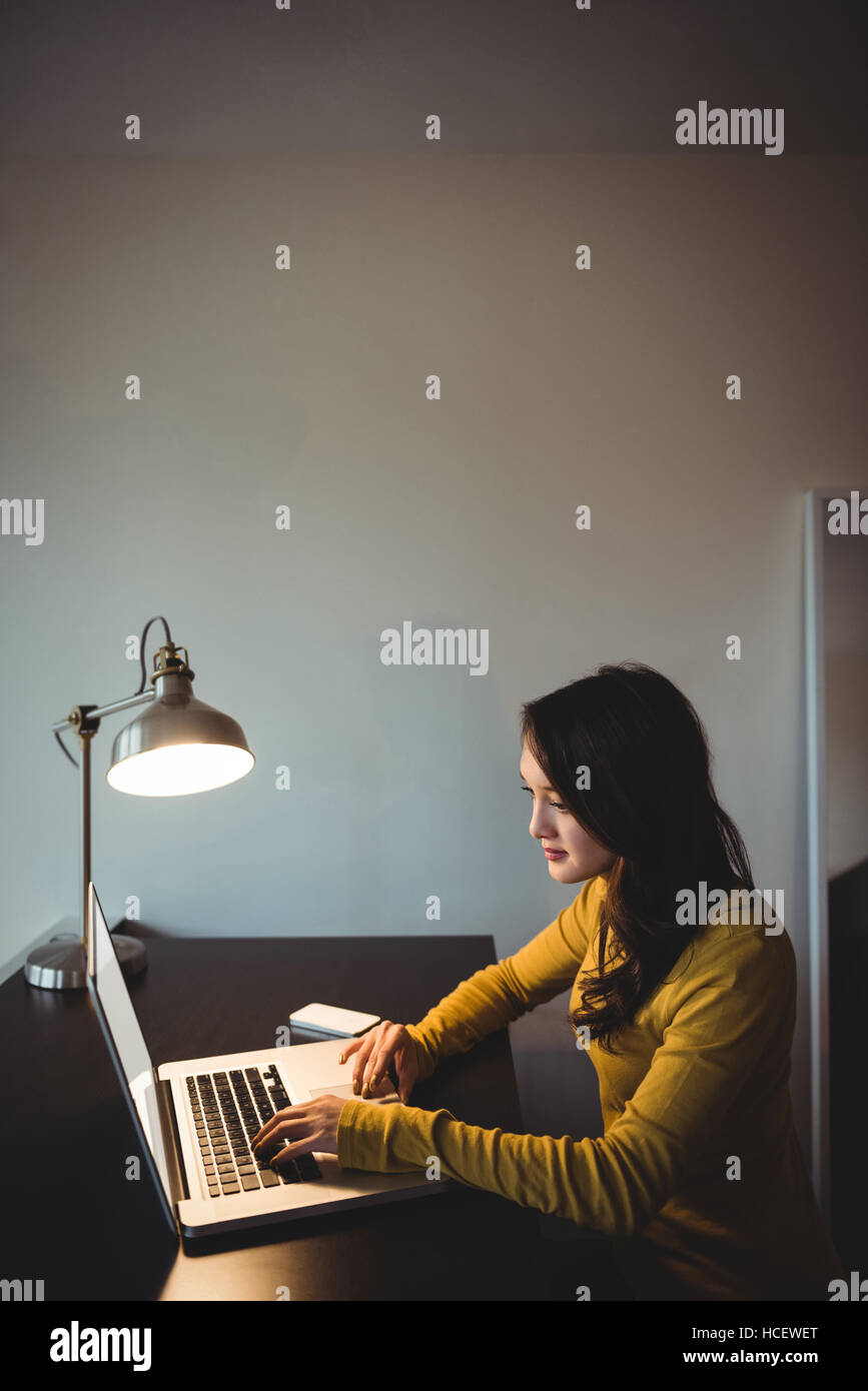 Woman working on laptop in study room Stock Photo - Alamy