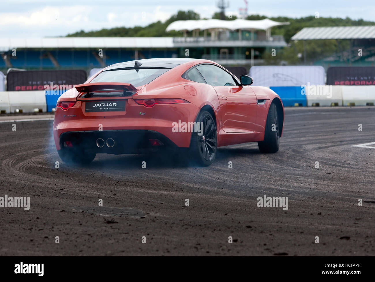 Drifting demonstration  performed in a Jaguar F-Type S  in the adrenaline zone of the Silverstone Classic 2016. Stock Photo