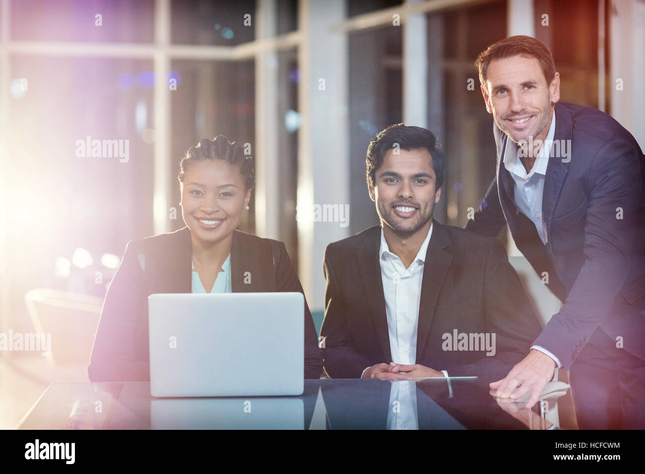 Portrait of business people sitting in meeting Stock Photo - Alamy