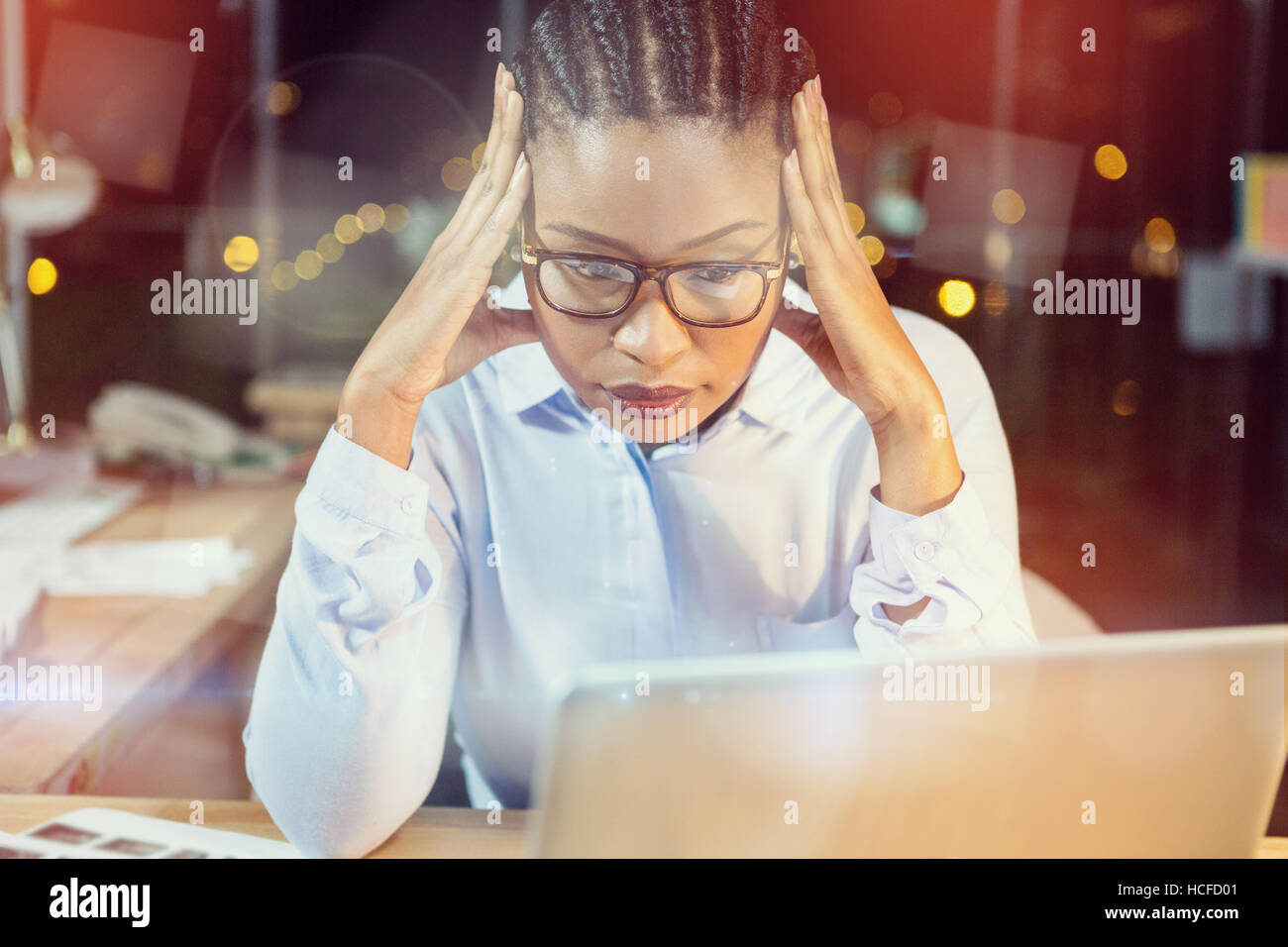 Stressed businesswoman sitting in office Stock Photo - Alamy
