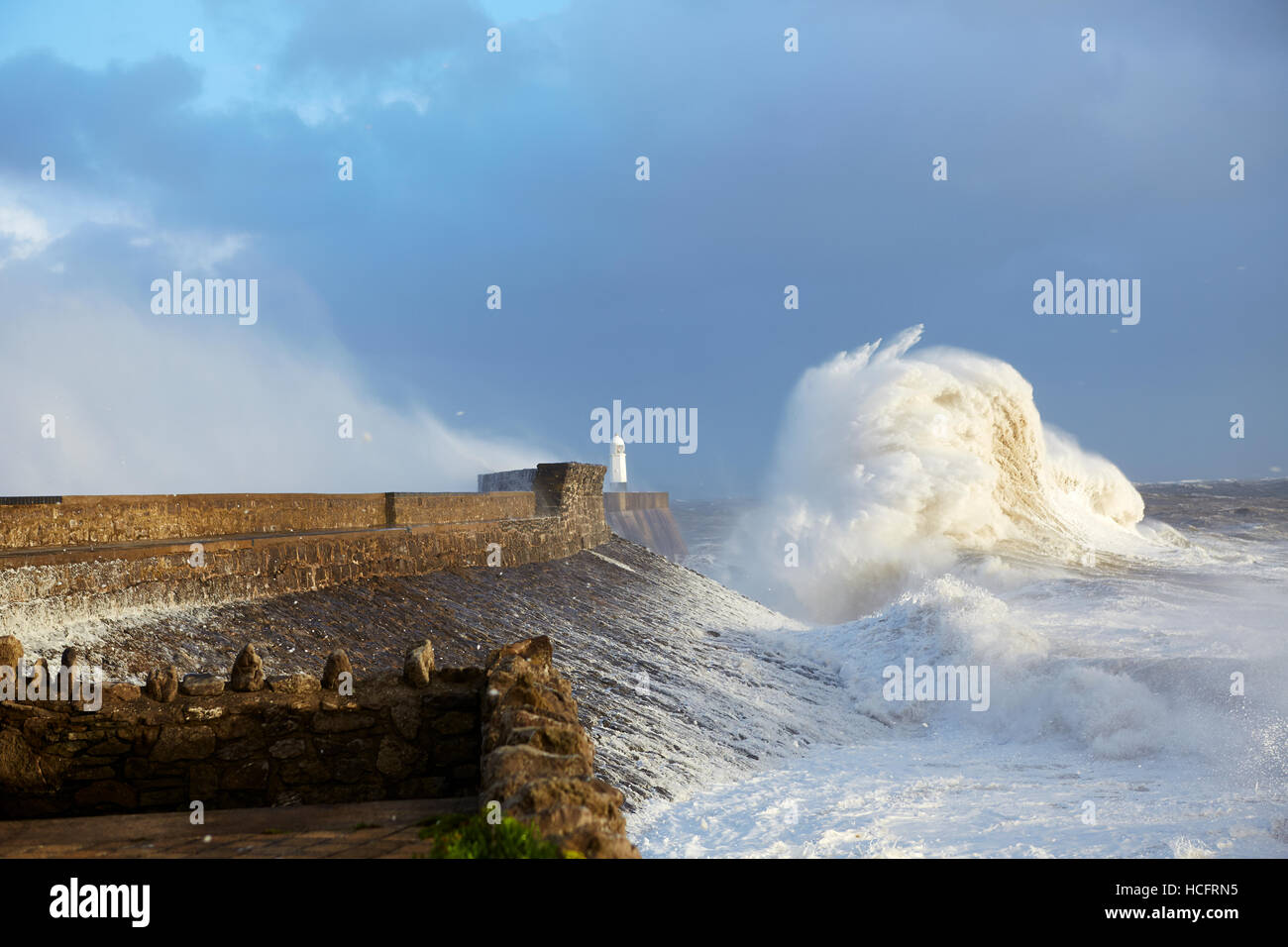 Storm waves crashing over the harbour wall in Porthcawl, South Wales, UK Stock Photo
