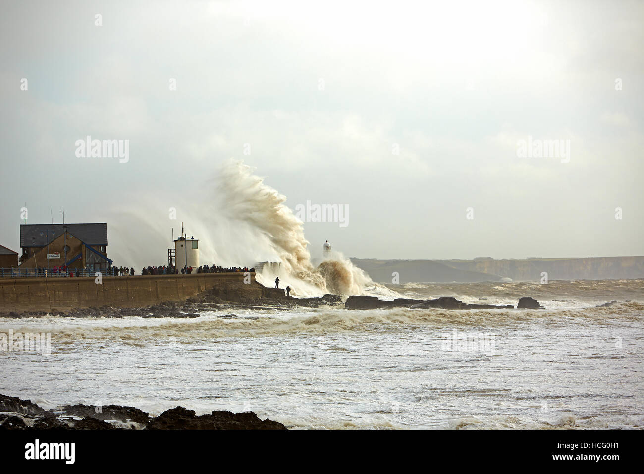 Storm Waves crashing over Porthcawl Harbour Wall, Porthcawl, Wales, UK Stock Photo