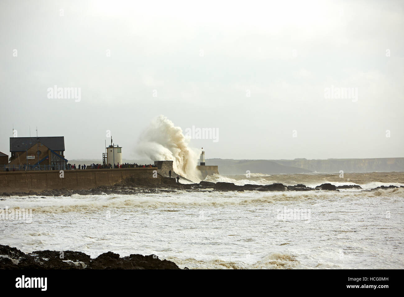 Storm Waves crashing over Porthcawl Harbour Wall, Porthcawl, Wales, UK Stock Photo