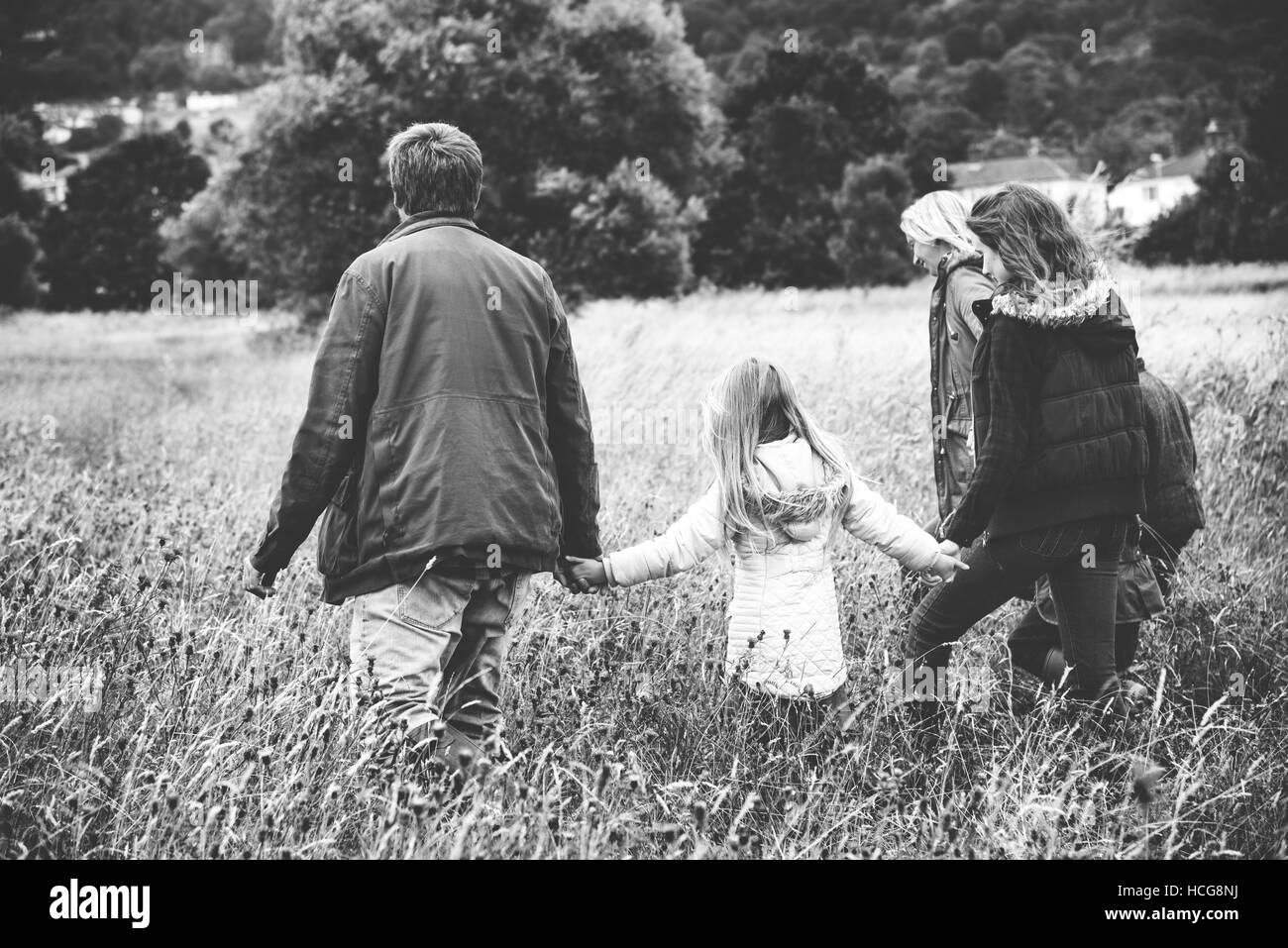 Family Walking Field Nature Togetherness Concept Stock Photo - Alamy