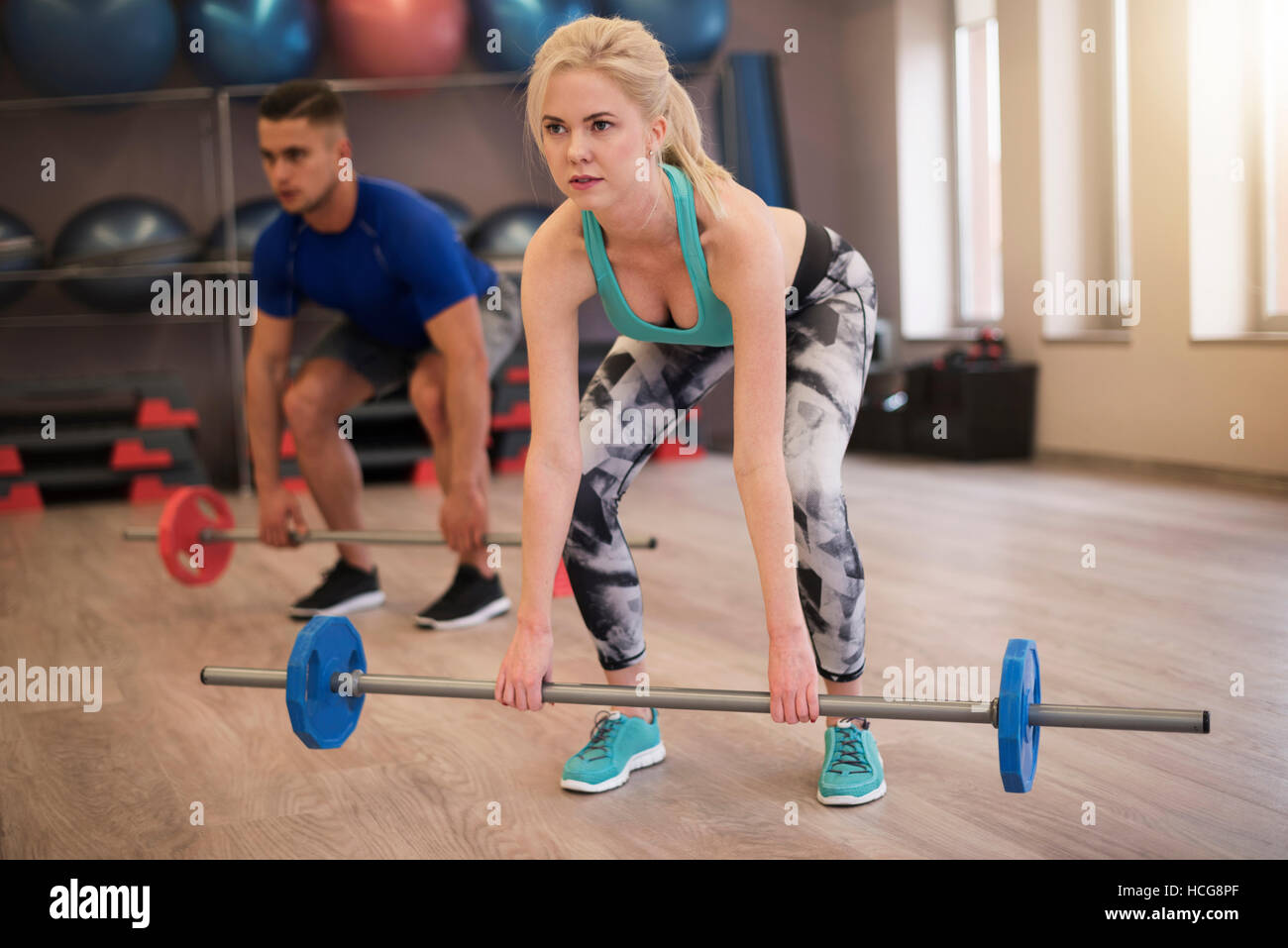 Couple doing dead lift together Stock Photo