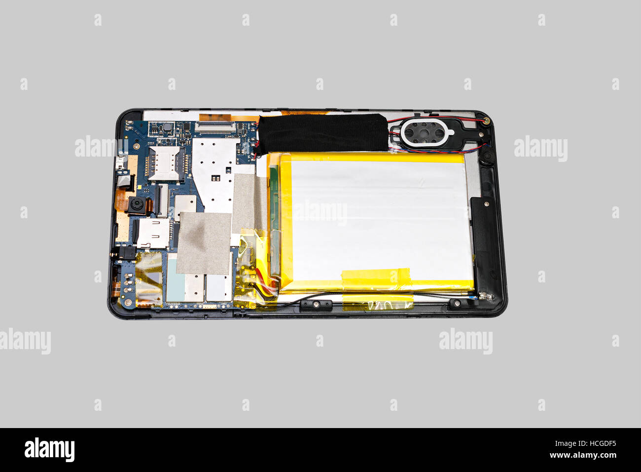 Disassembled tablet computer. Isolated on gray background Stock Photo ...