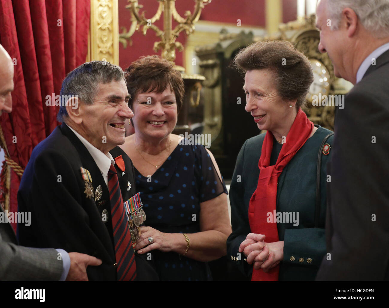 The Princess Royal with D-Day veteran Abraham Young, 93, of the Royal Engineers, during a Christmas Party at St James's Palace, London for The Not Forgotten Association - a national tri-service charity which provides entertainment, leisure and recreation for the serving wounded, injured or sick and for ex-service men and women with disabilities. Stock Photo