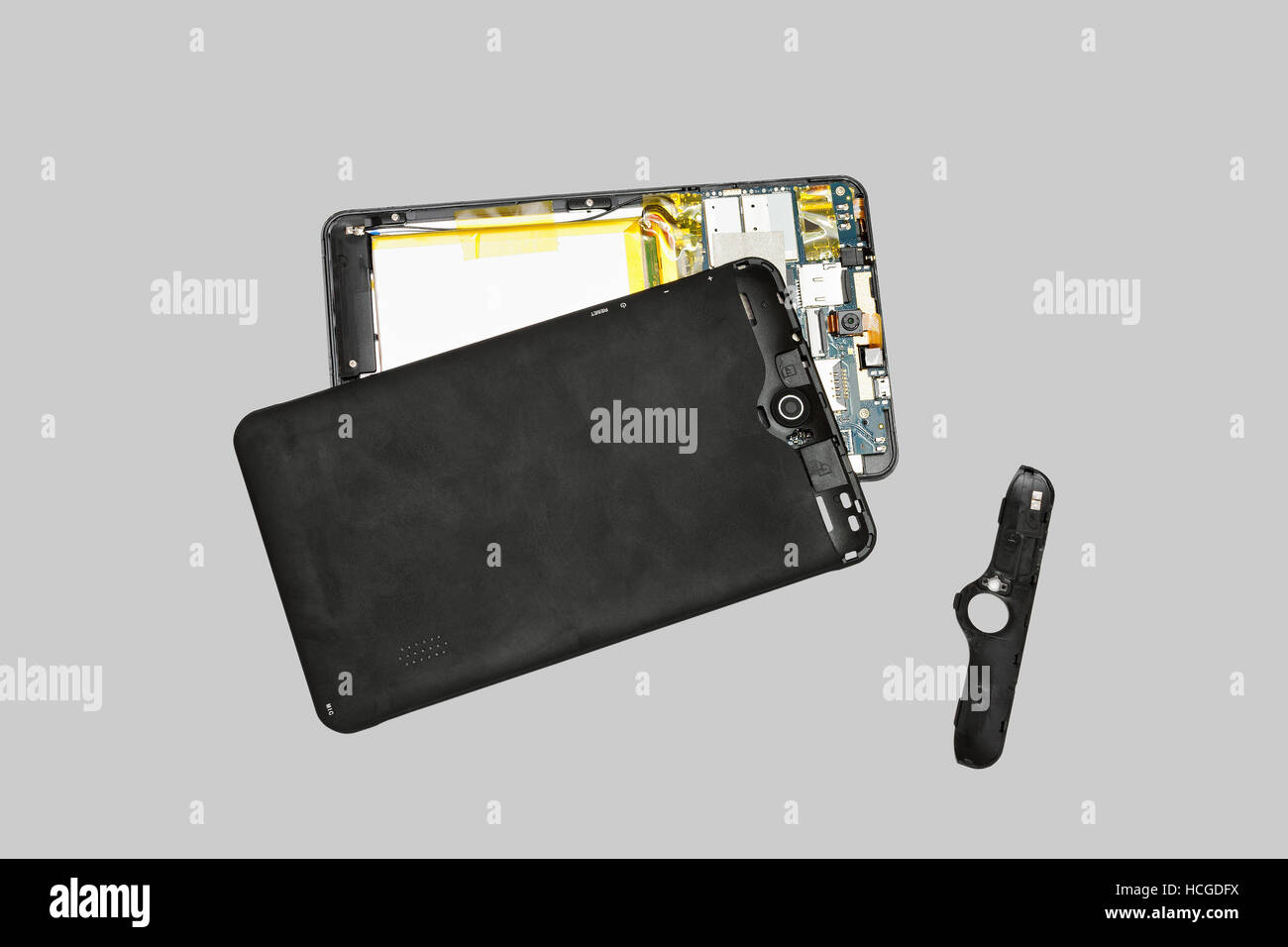 Disassembled tablet computer. Isolated on gray background Stock Photo ...
