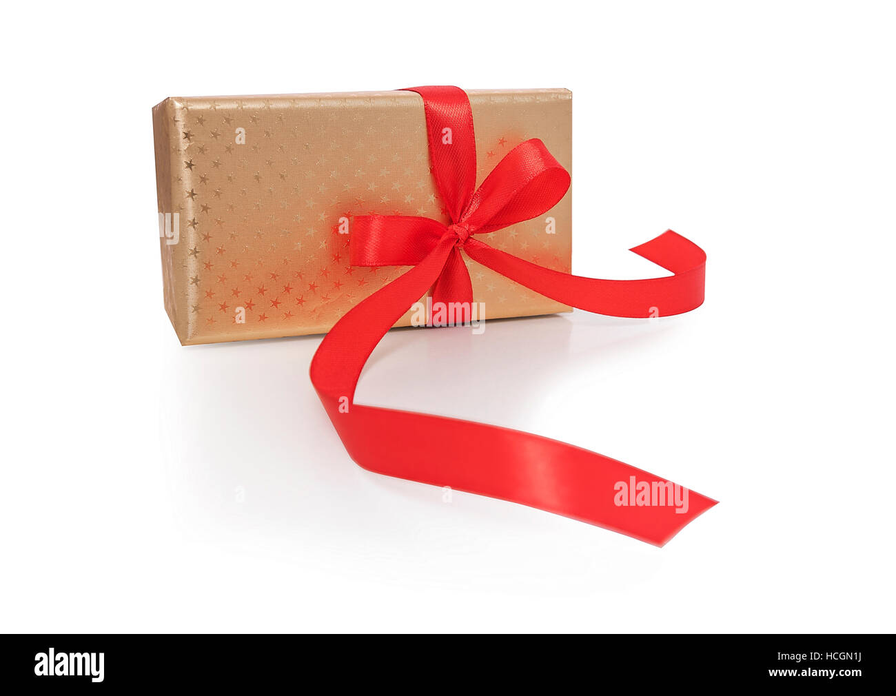 Gold box with red ribbon. Stock Photo