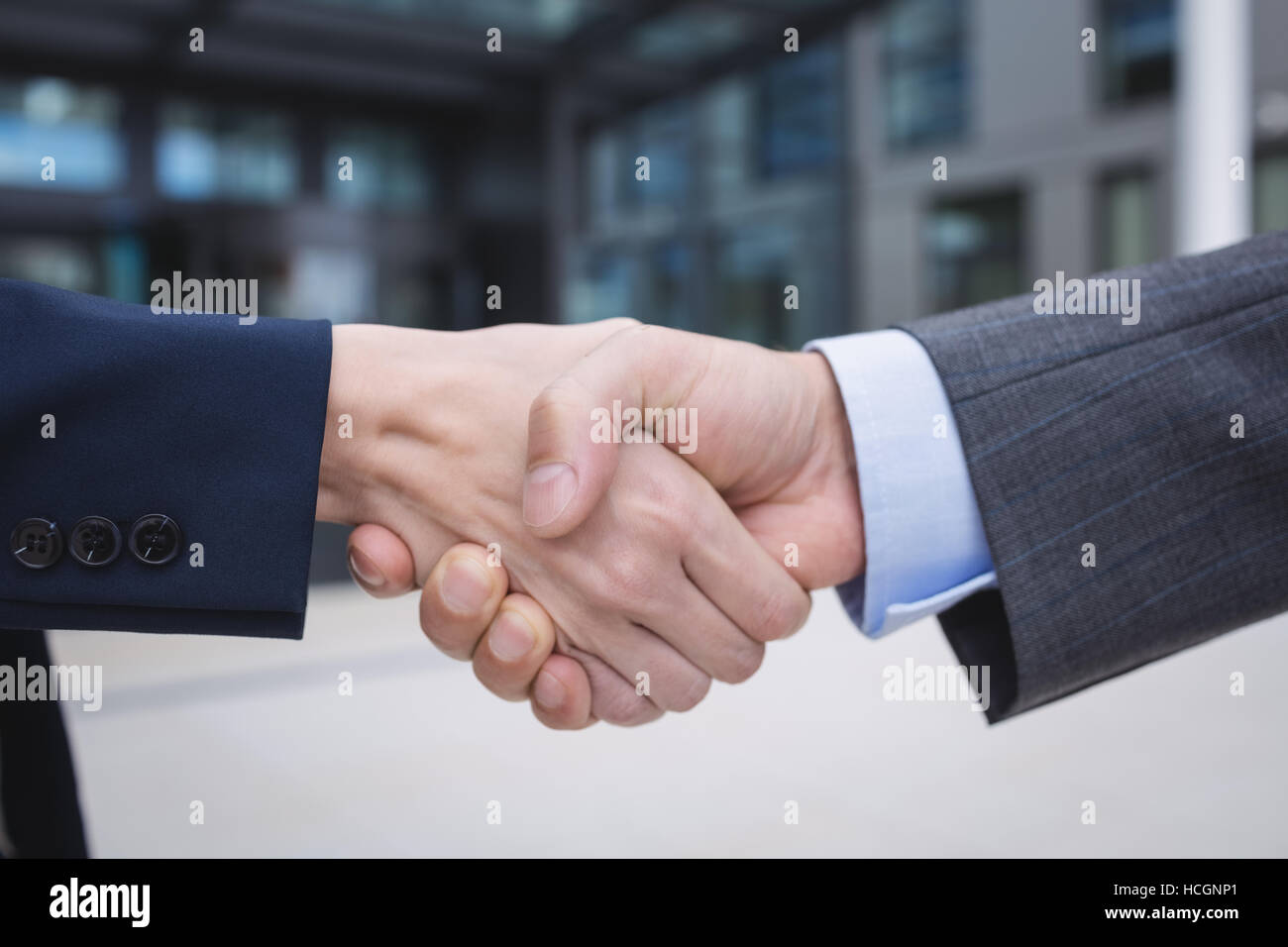 Businesspeople shaking hands Stock Photo