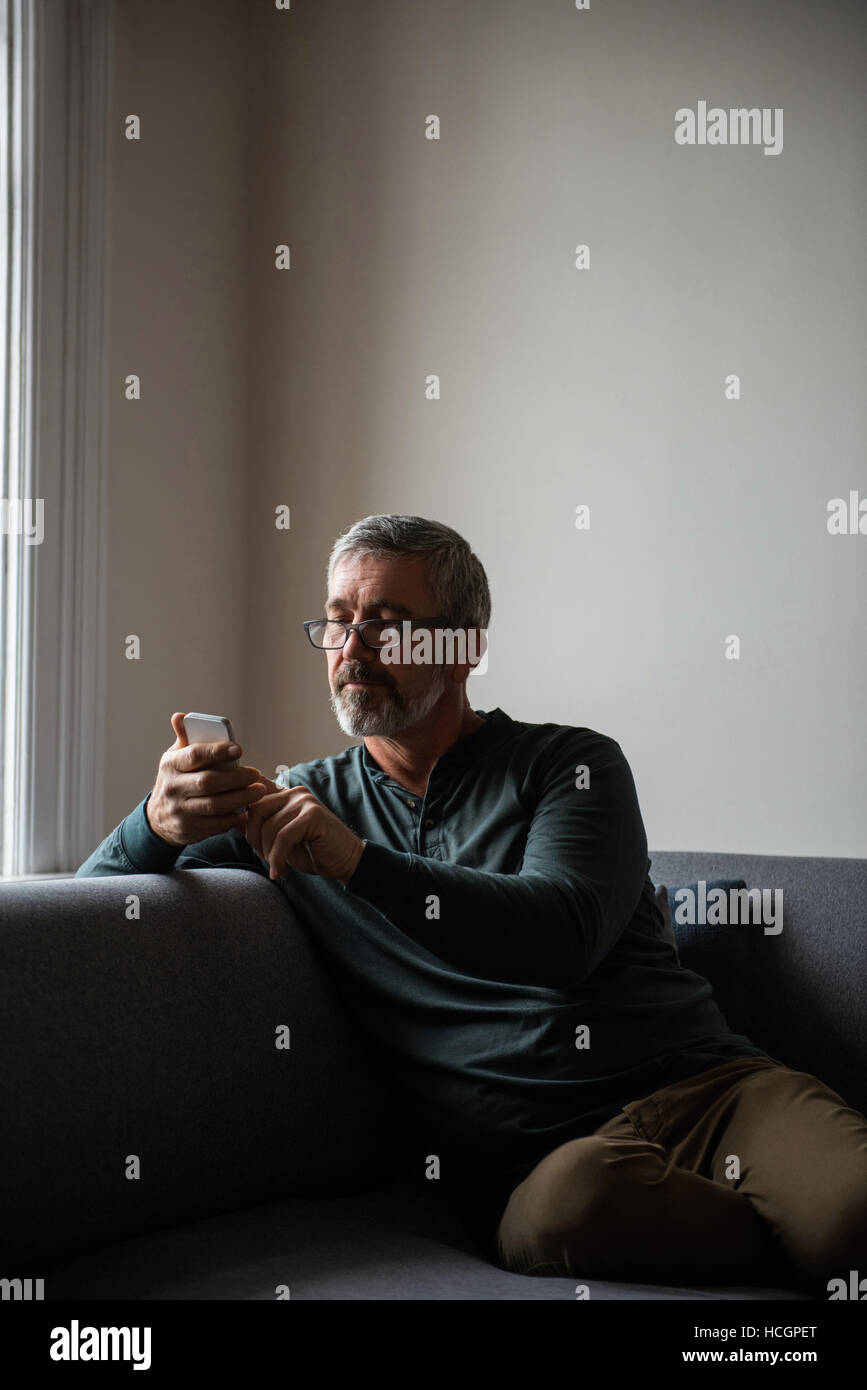 Mobile phone touchscreen in male hi-res stock photography and images ...