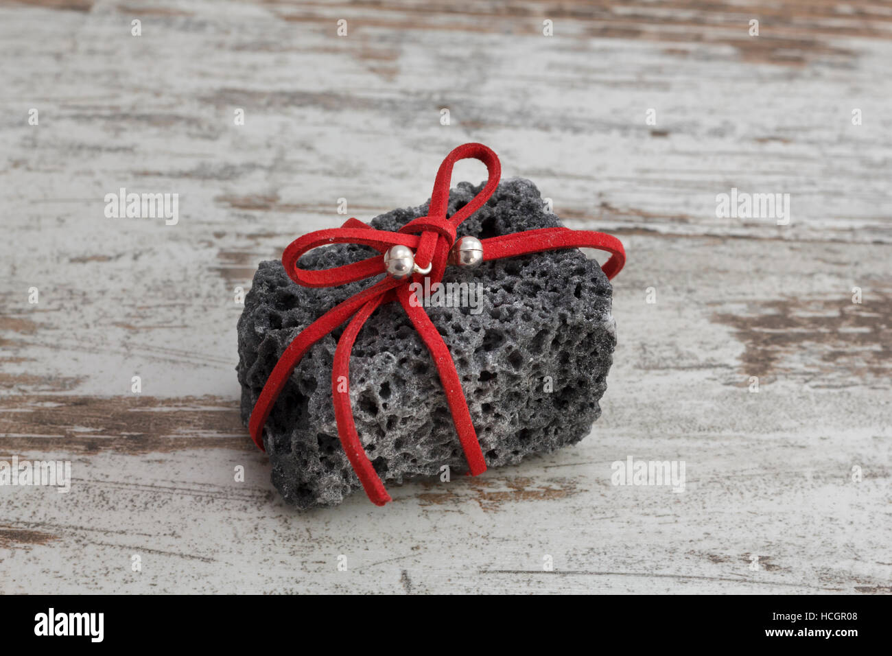 Christmas coal with red ribbon, sweet gift for naughty boys Stock Photo