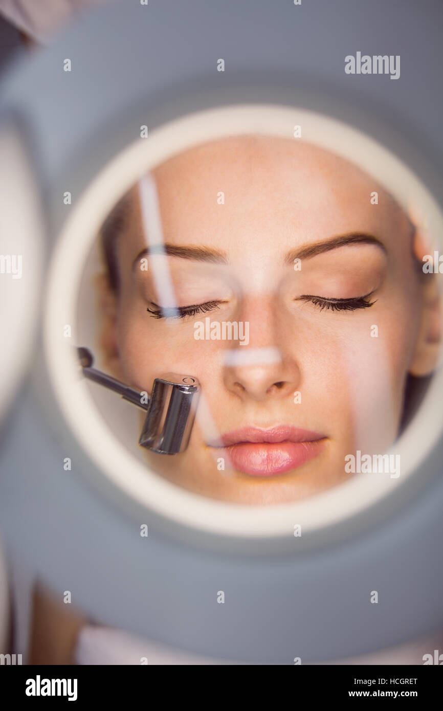Dermatologist performing laser hair removal on patient Stock Photo Alamy