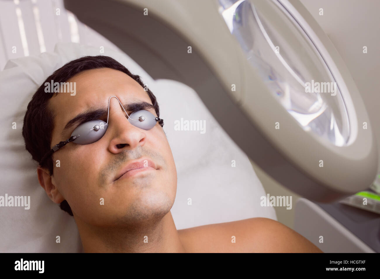 Patient wearing laser protective glasses Stock Photo Alamy