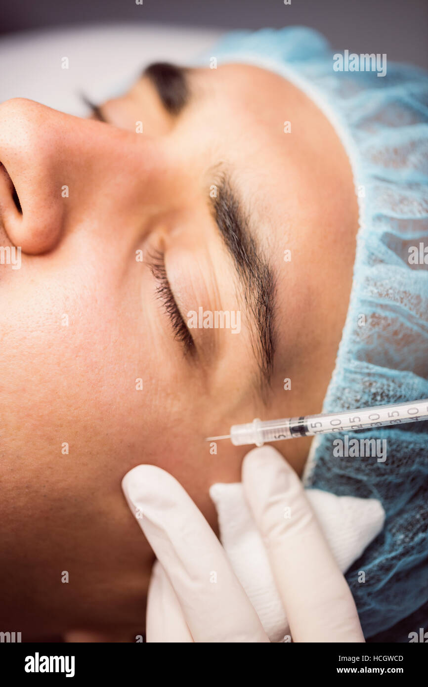 Man receiving botox injection on his face Stock Photo