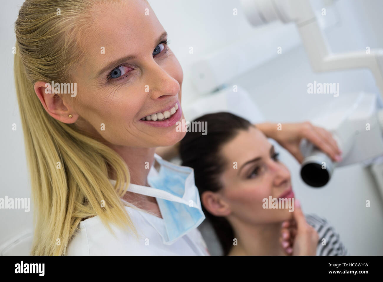Dentist taking a female patients tooth xray Stock Photo Alamy