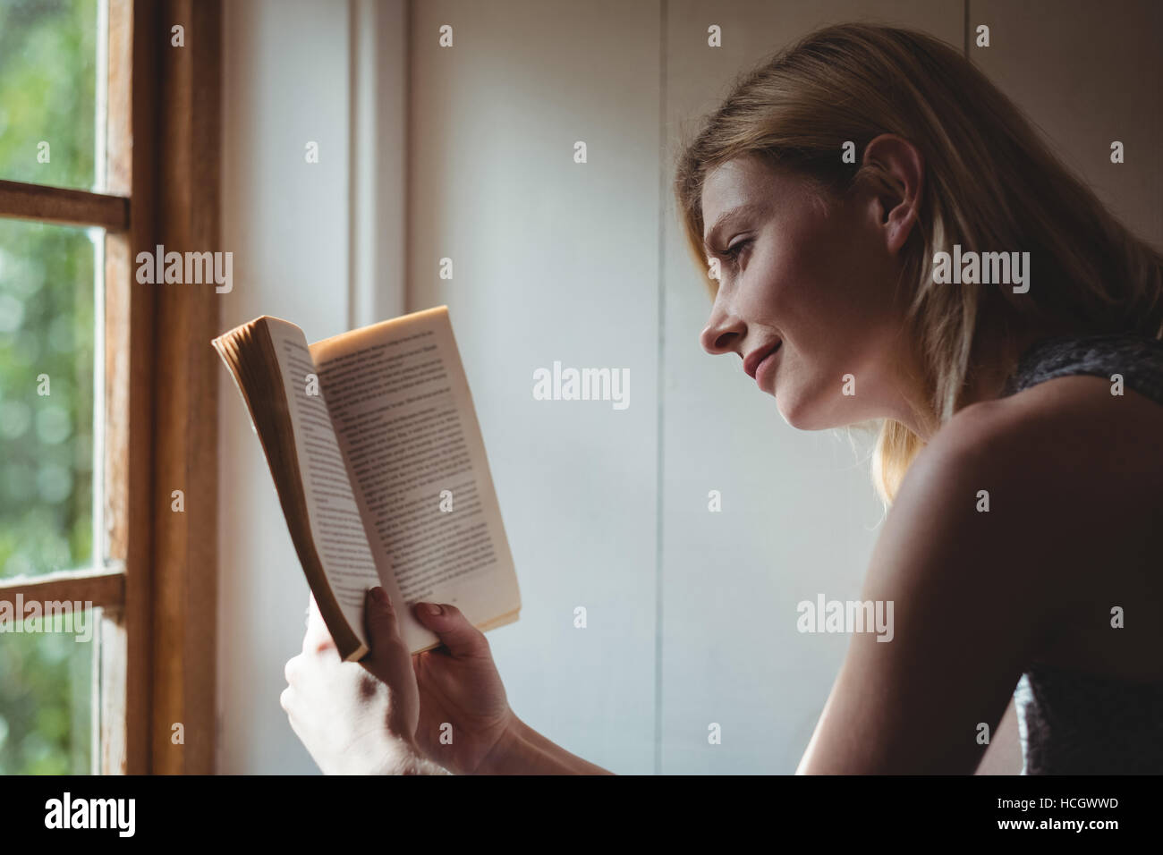 Beautiful woman reading book Stock Photo