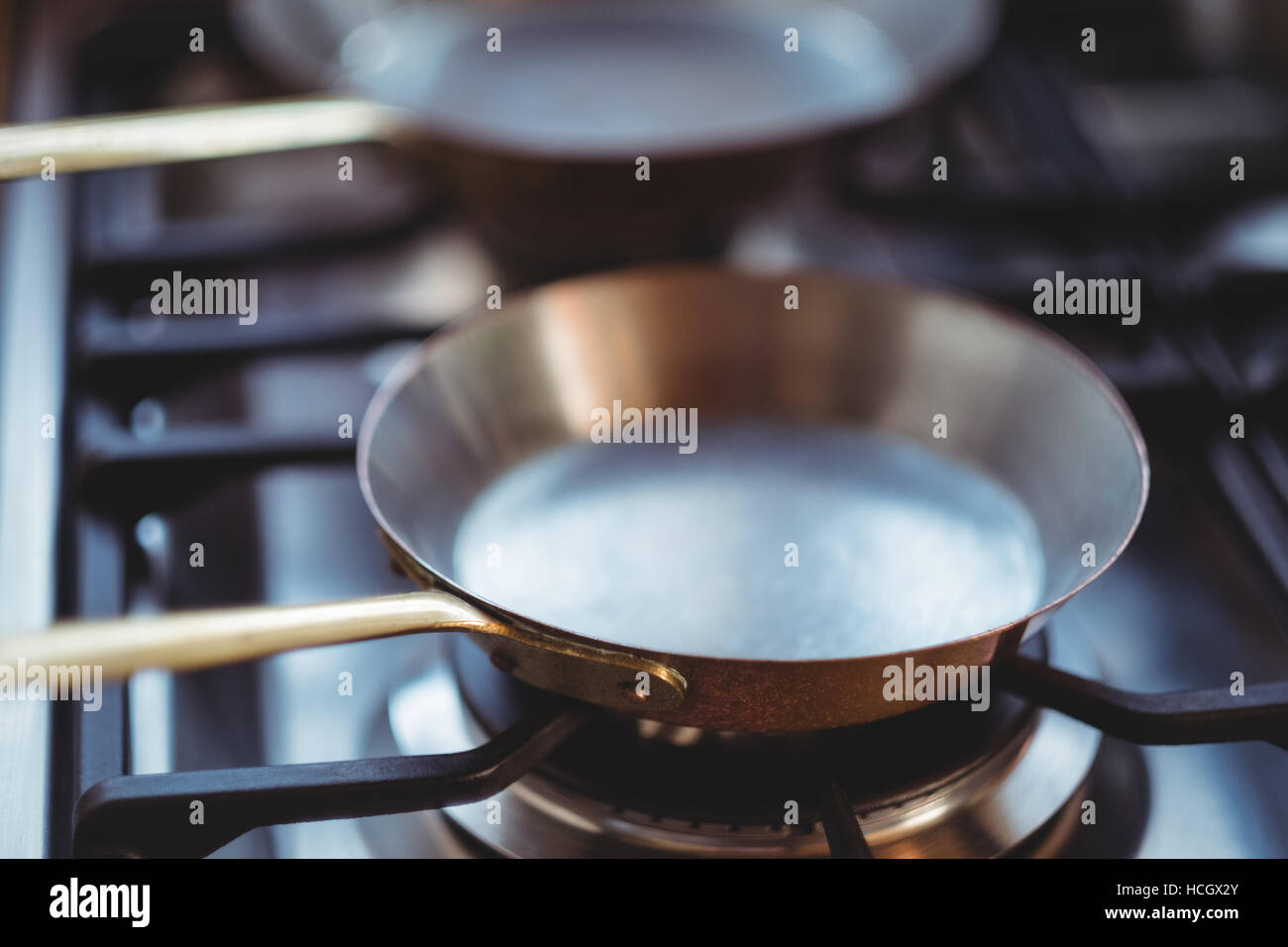 Close-up of frying pan on stove Stock Photo