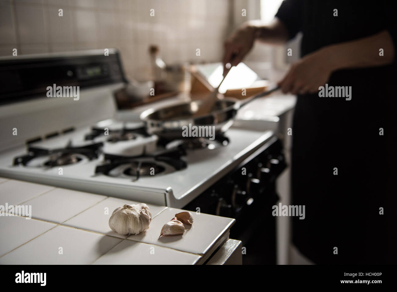 Man preparing food in kitchen Stock Photo