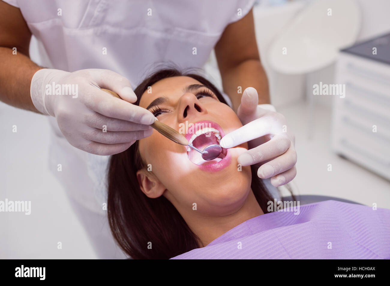 Dentist examining Patient teeth with a mouth mirror Stock Photo Alamy