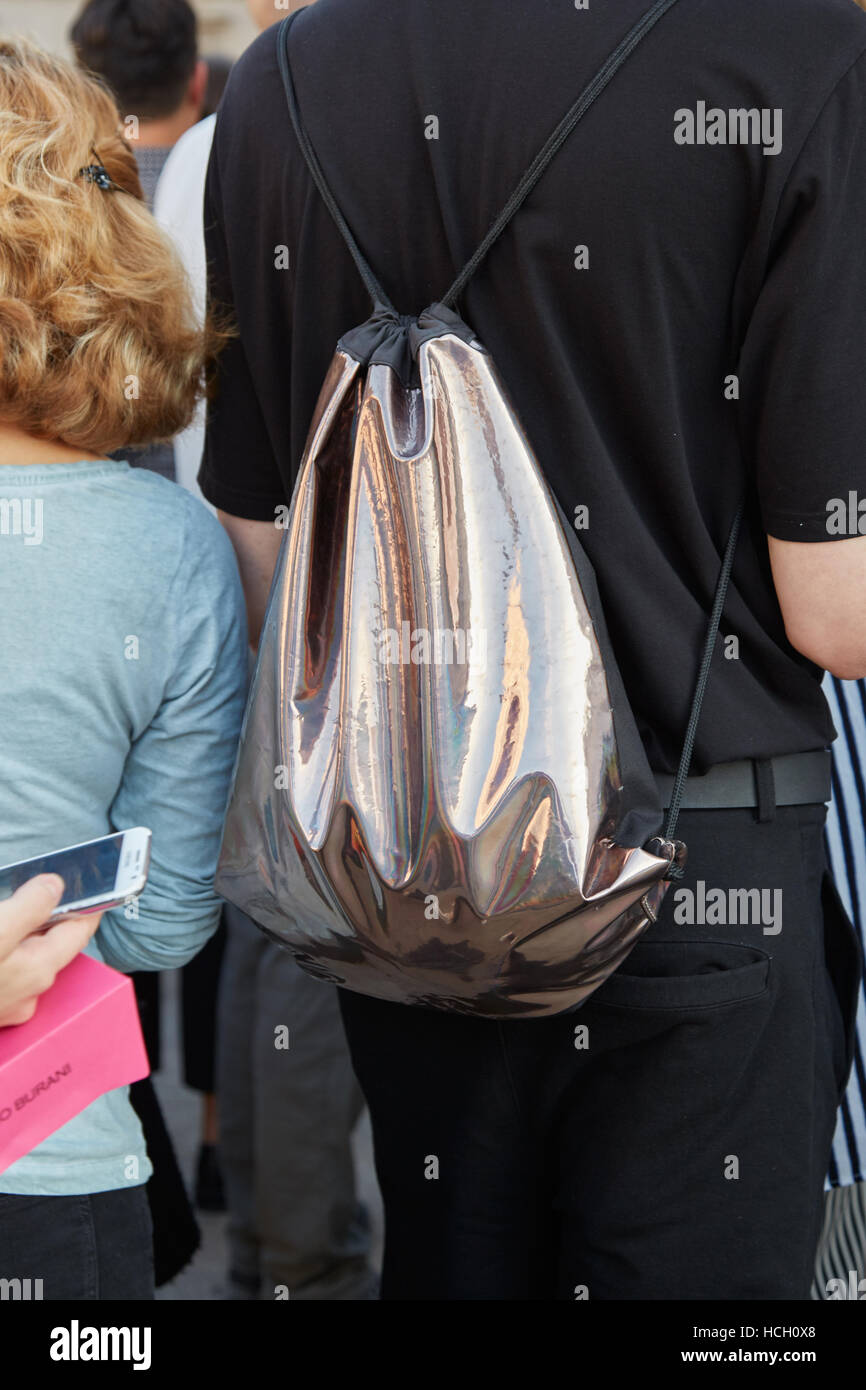 Man with metallic silver backpack before Cristiano Burani fashion show, Milan Fashion Week street style on September 22, 2016. Stock Photo