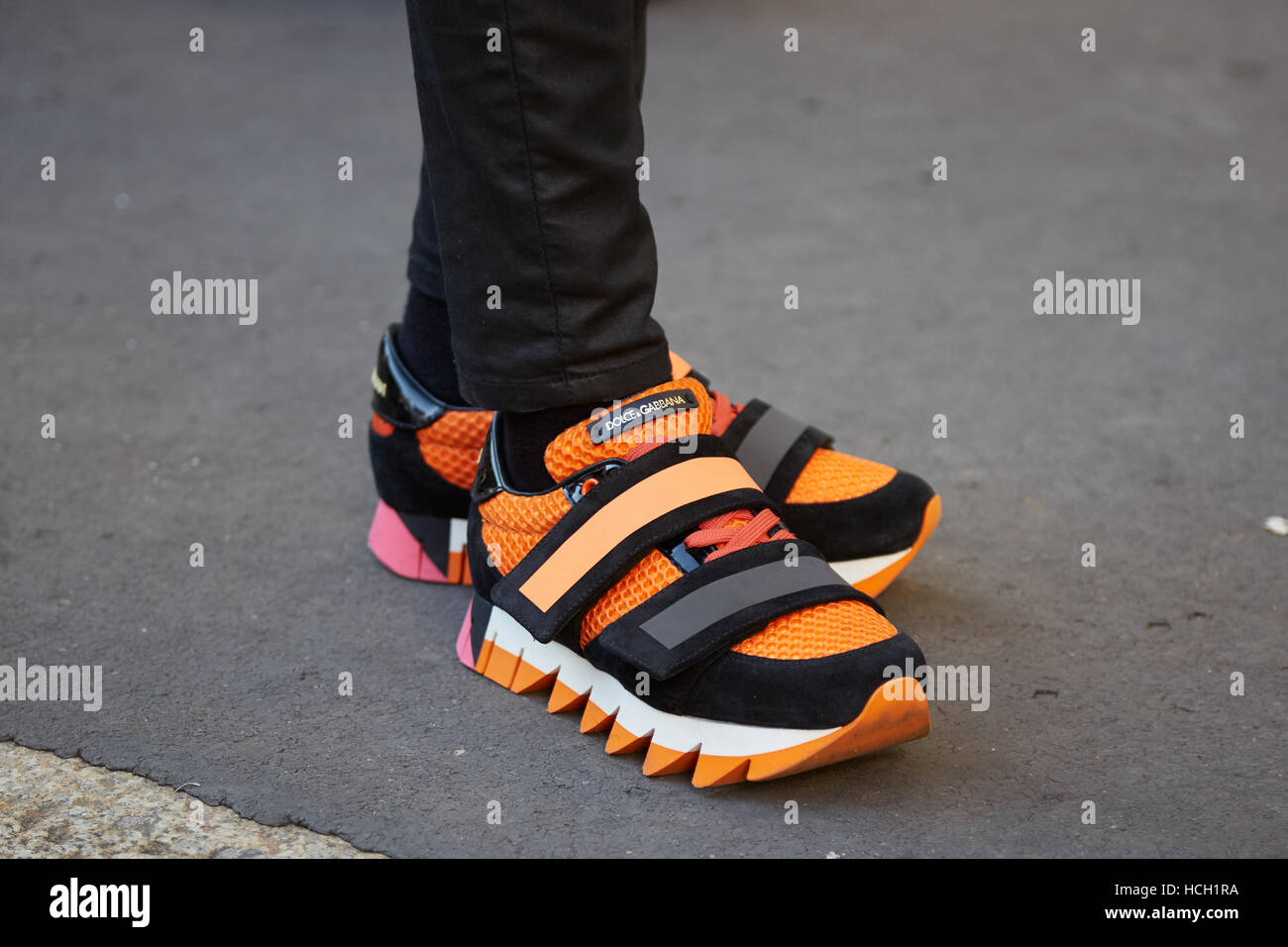 Woman with Dolce Gabbana orange and black shoes before Salvatore Ferragamo  fashion show, Milan Fashion Week street style Stock Photo - Alamy