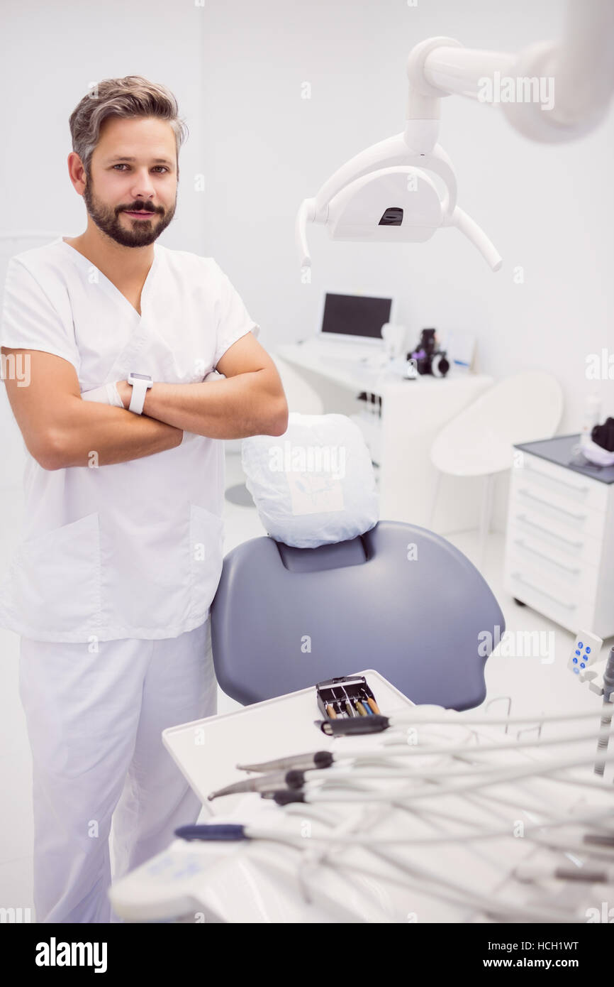 Dentist standing with his arms crossed Stock Photo
