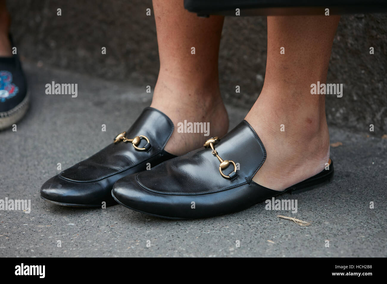 Man with black leather Gucci shoes before Max Mara fashion show, Milan Fashion Week street style on September 22, 2016 in Milan. Stock Photo