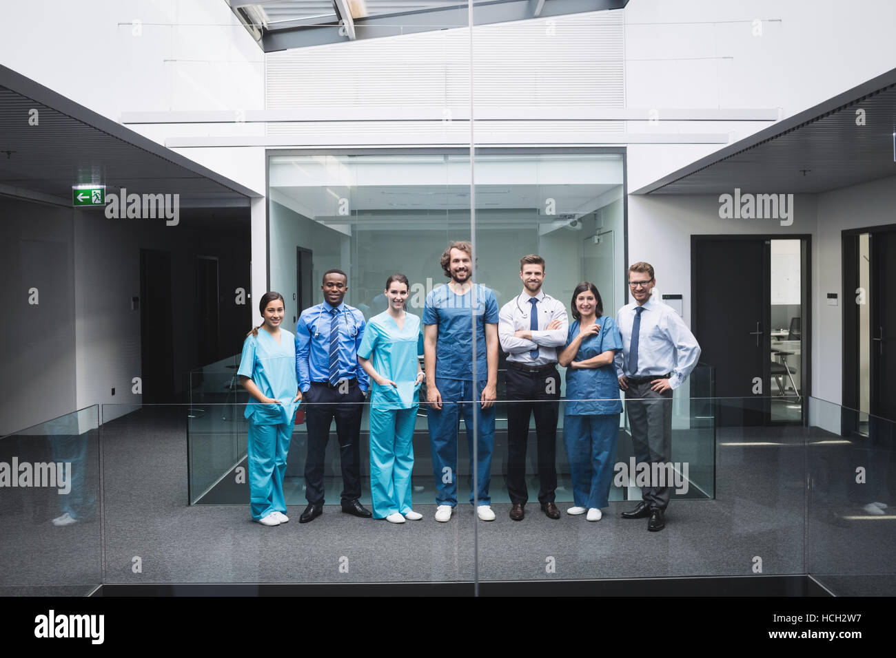 Team of doctors standing in corridor Stock Photo - Alamy