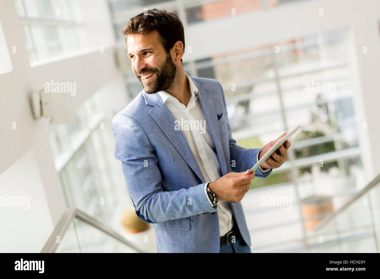 View at Businessman using his digital tablet at the office Stock Photo ...