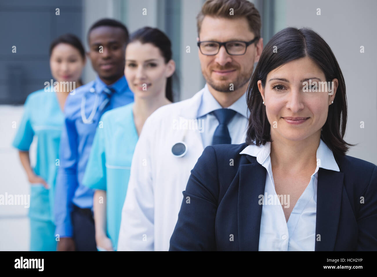 Team of doctors standing in row Stock Photo