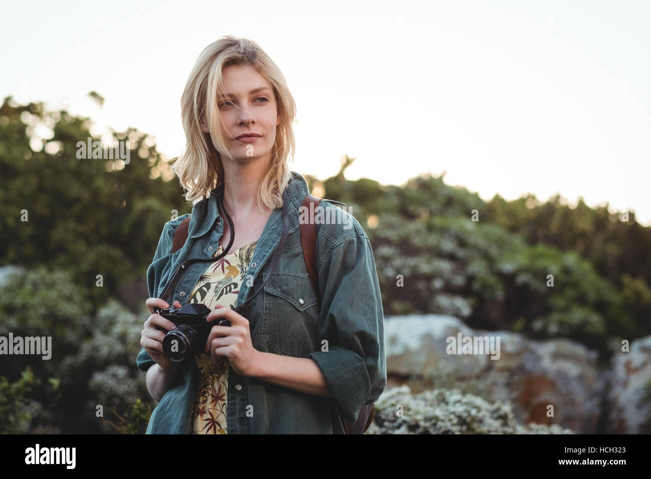 Woman holding digital camera Stock Photo