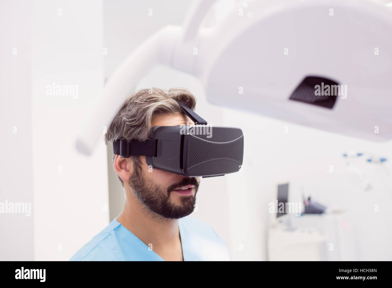 Dentist using virtual reality headset Stock Photo