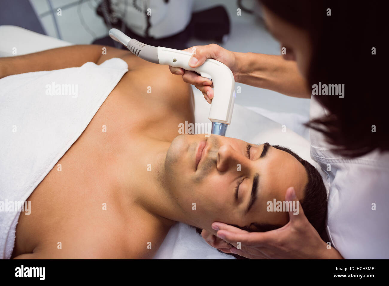 Patient receiving facial treatment Stock Photo