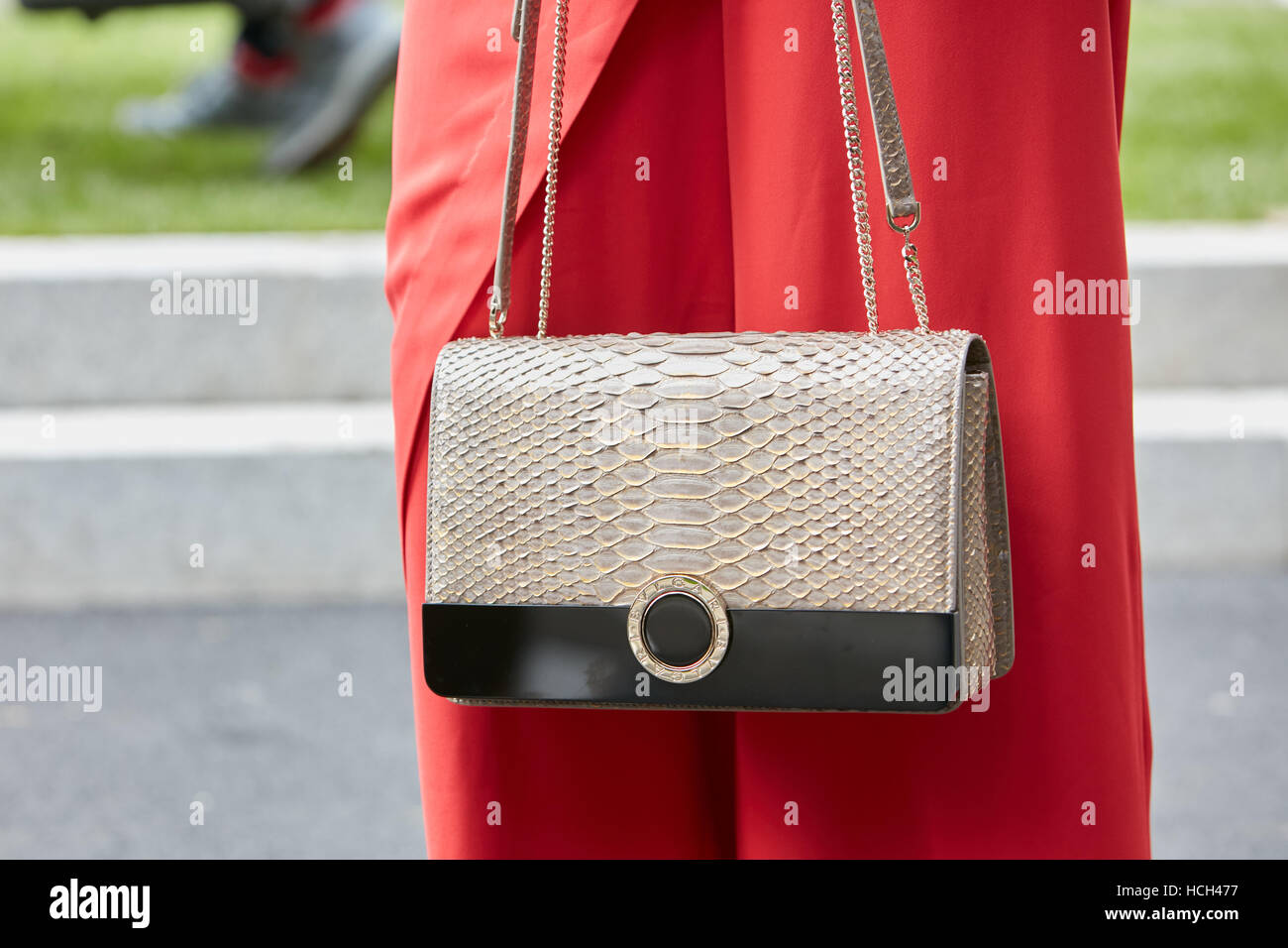 Woman with Bulgari bag before Giorgio Armani fashion show, Milan Fashion Week street style on September 23, 2016 in Milan. Stock Photo