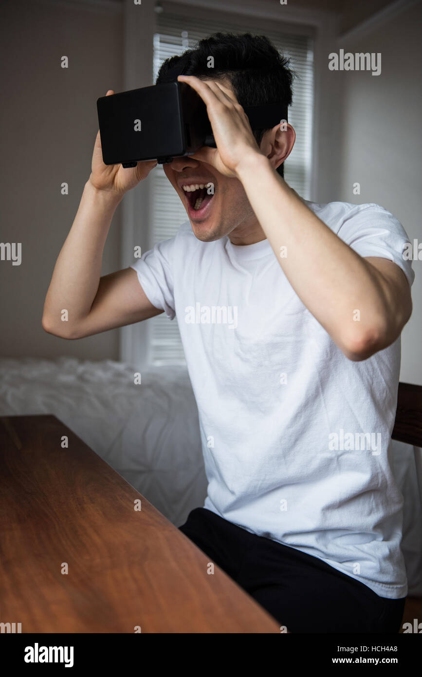 Man using virtual reality headset Stock Photo - Alamy