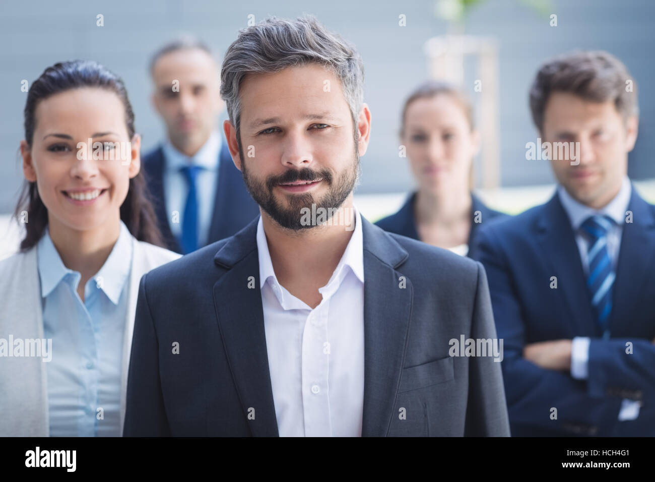 Confident businessman with colleagues Stock Photo