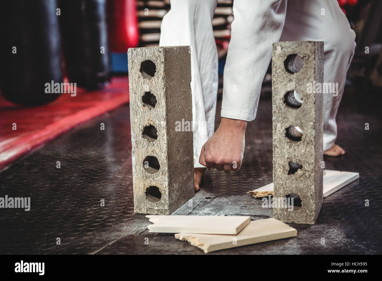 Karate player breaking wooden plank Stock Photo