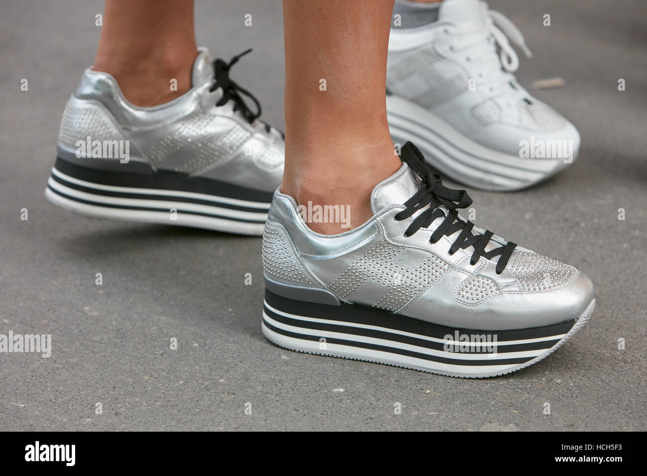 Woman with silver shoes before fashion Tod's show, Milan Fashion Week street style on September 23, 2016 in Milan Stock Photo - Alamy