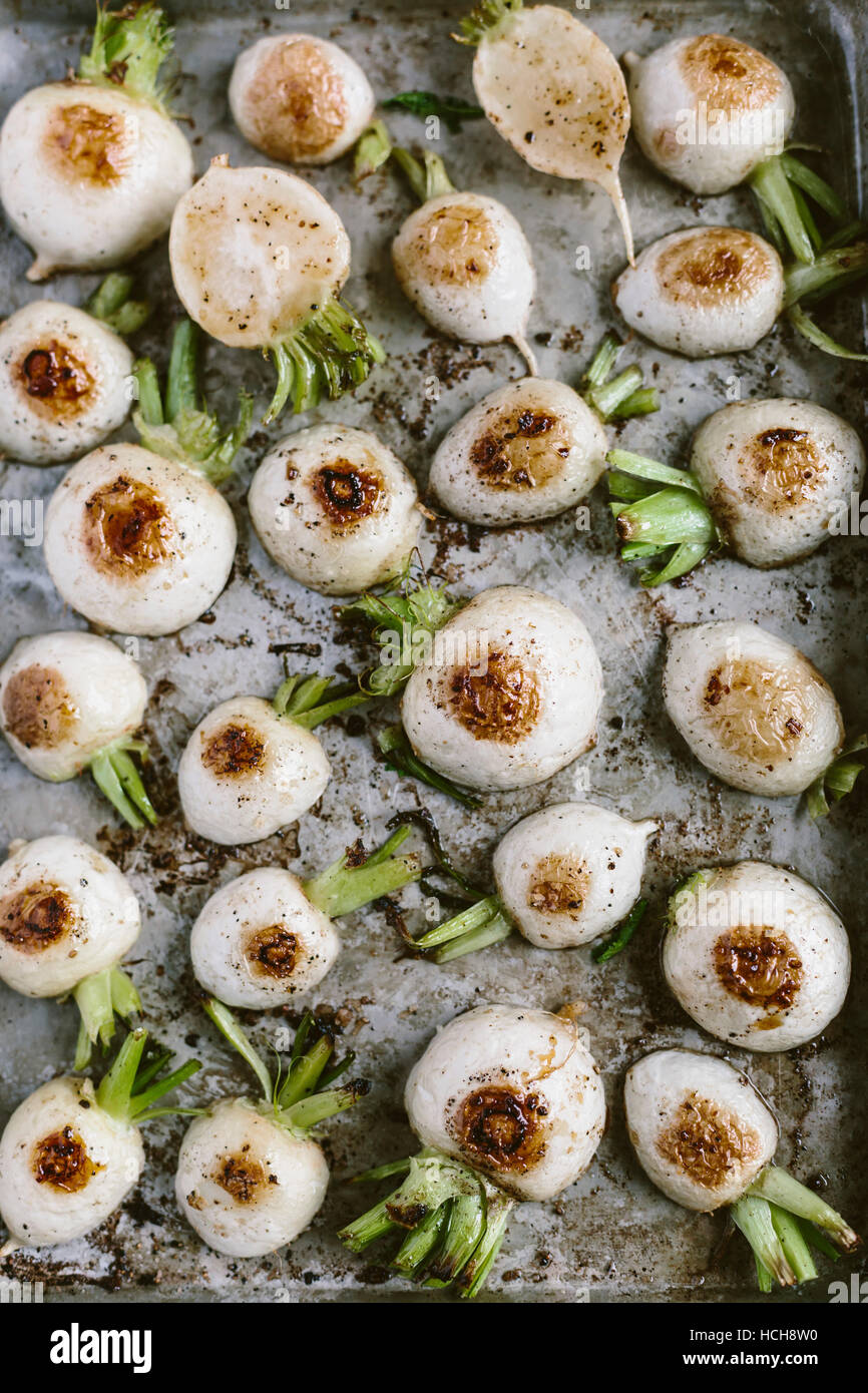 Roasted Japanese turnips are photographed in the pan right after they