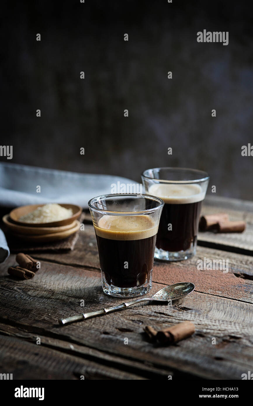 Glasses of espresso on rustic table Stock Photo