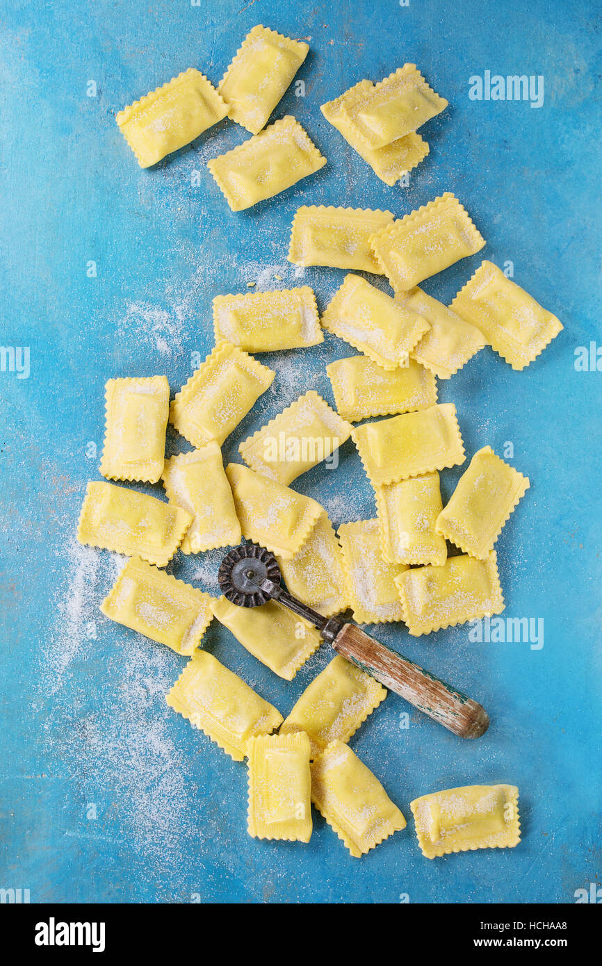 Fresh maked raw uncooked italian pasta ravioli with flour and vintage