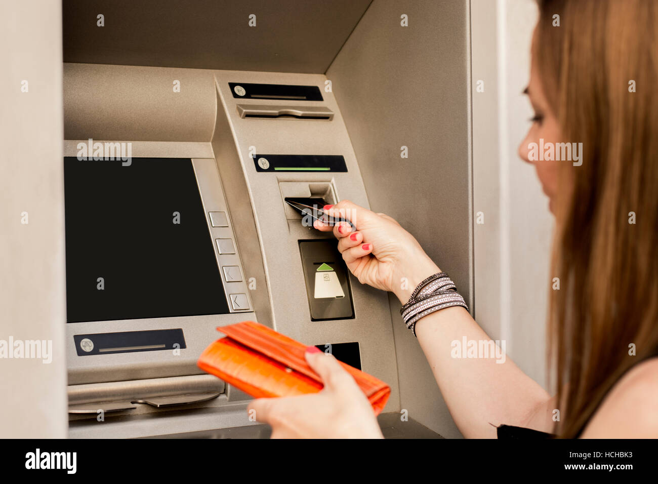 Inserting credit card in atm hires stock photography and images Alamy