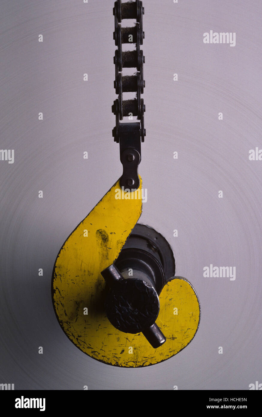 Roll of paper suspended on hooks at printing facility Stock Photo Alamy