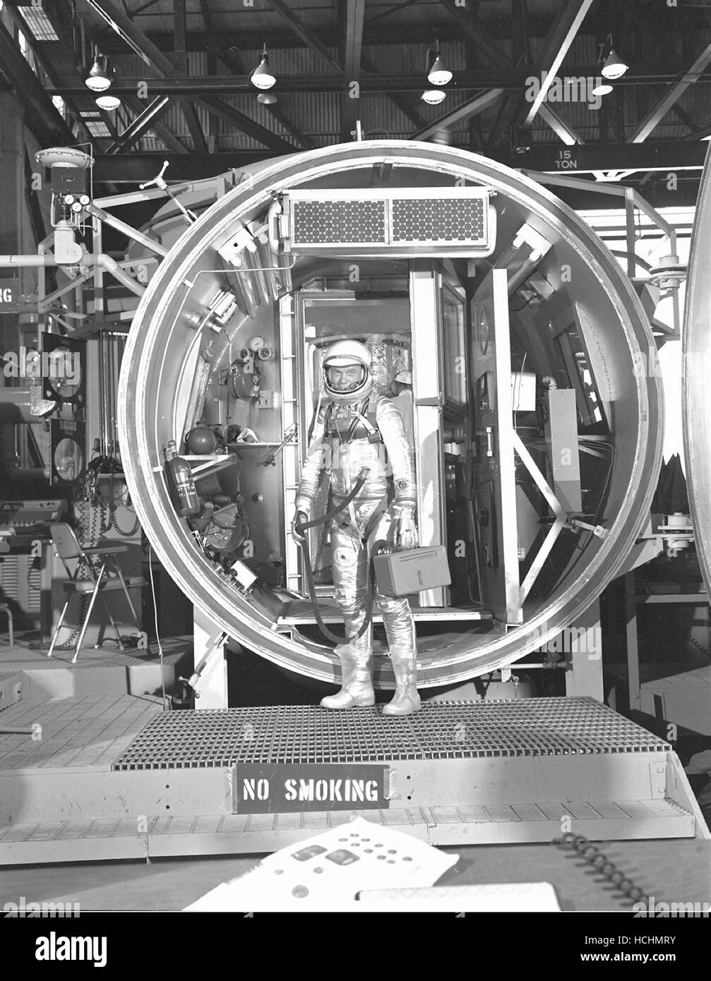 Astronaut John H. Glenn Jr., suited with hose to suit ventilation unit attached, during altitude chamber test in 1961. He is standing in the entrance to the test chamber with his helmet visor down.Credit: NASA via CNP /MediaPunch Stock Photo