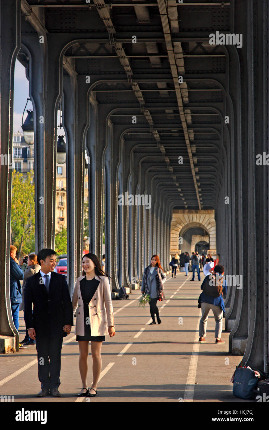 Tourists posing at the Bir-Hakeim bridge, Paris, France. Stock Photo