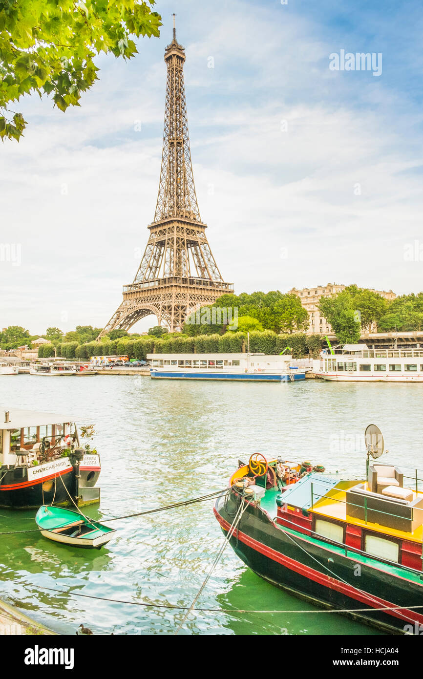 eiffel tower and boats on river seine Stock Photo