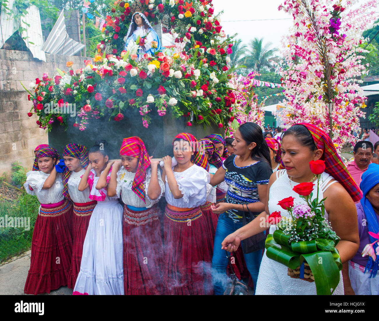 Salvadorian people participate in the procession of the Flower & Palm