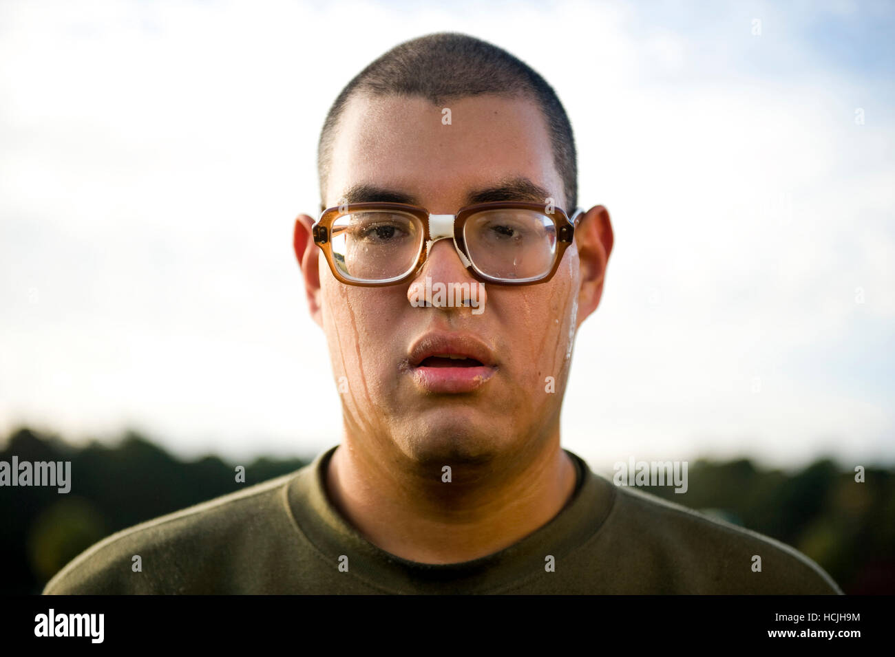 A marine recruit stands in formation during physical training. His